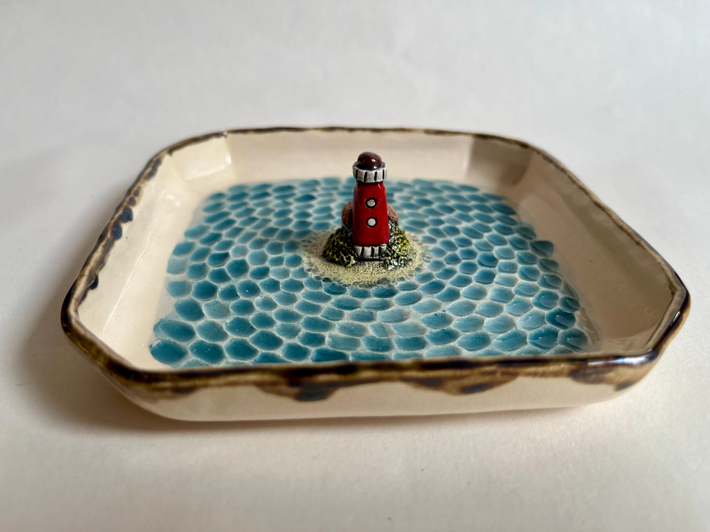 Lighthouse by the sea ceramic diorama