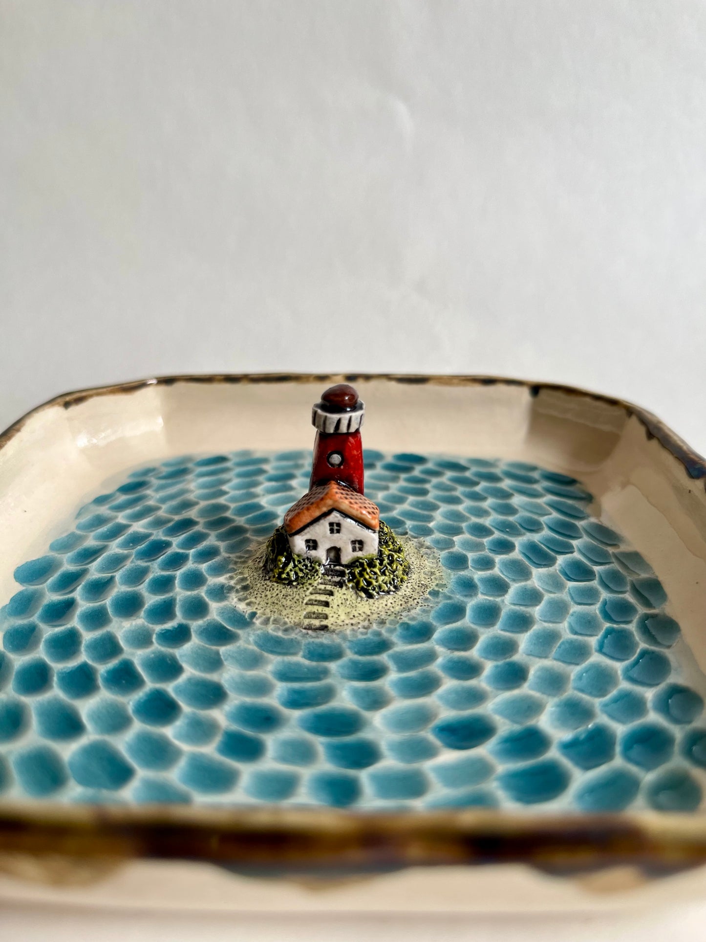 Lighthouse by the sea ceramic diorama