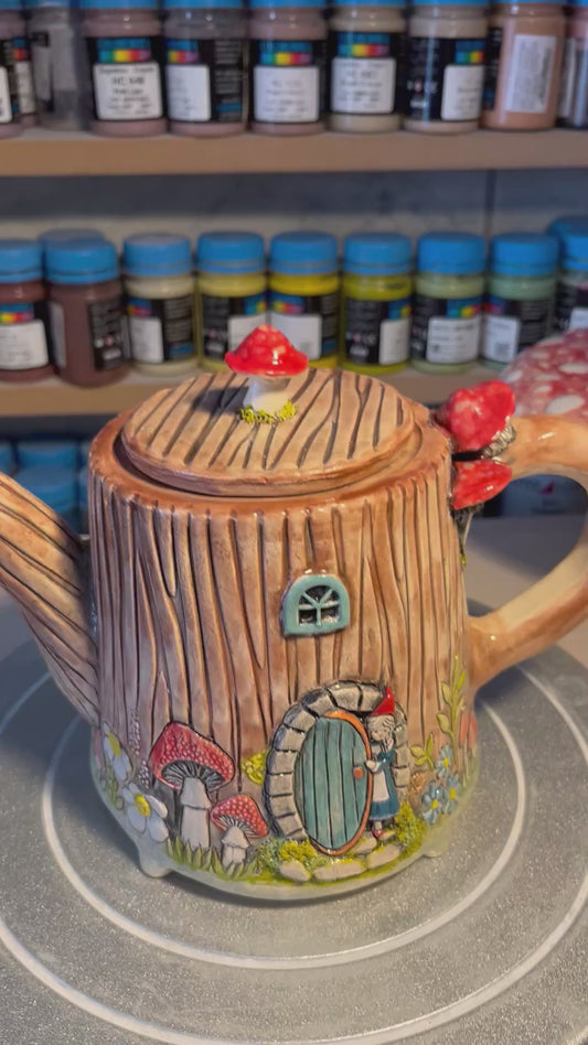 Rosa in the tree stump house teapot